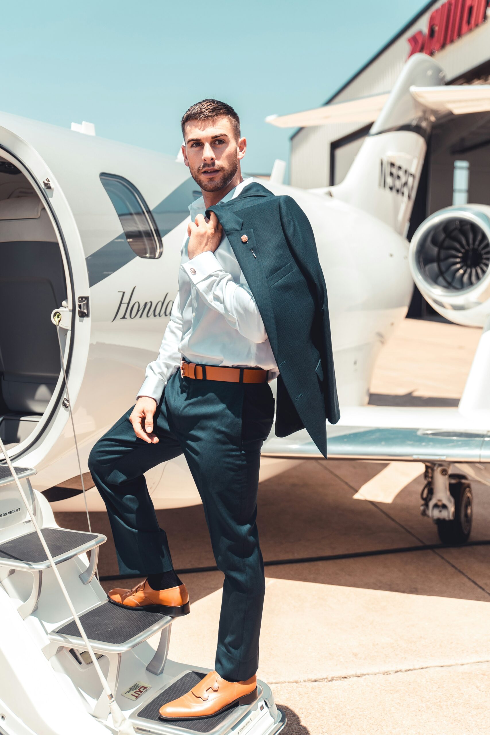 Business executive boarding private jet for luxury air travel from Long Island NY